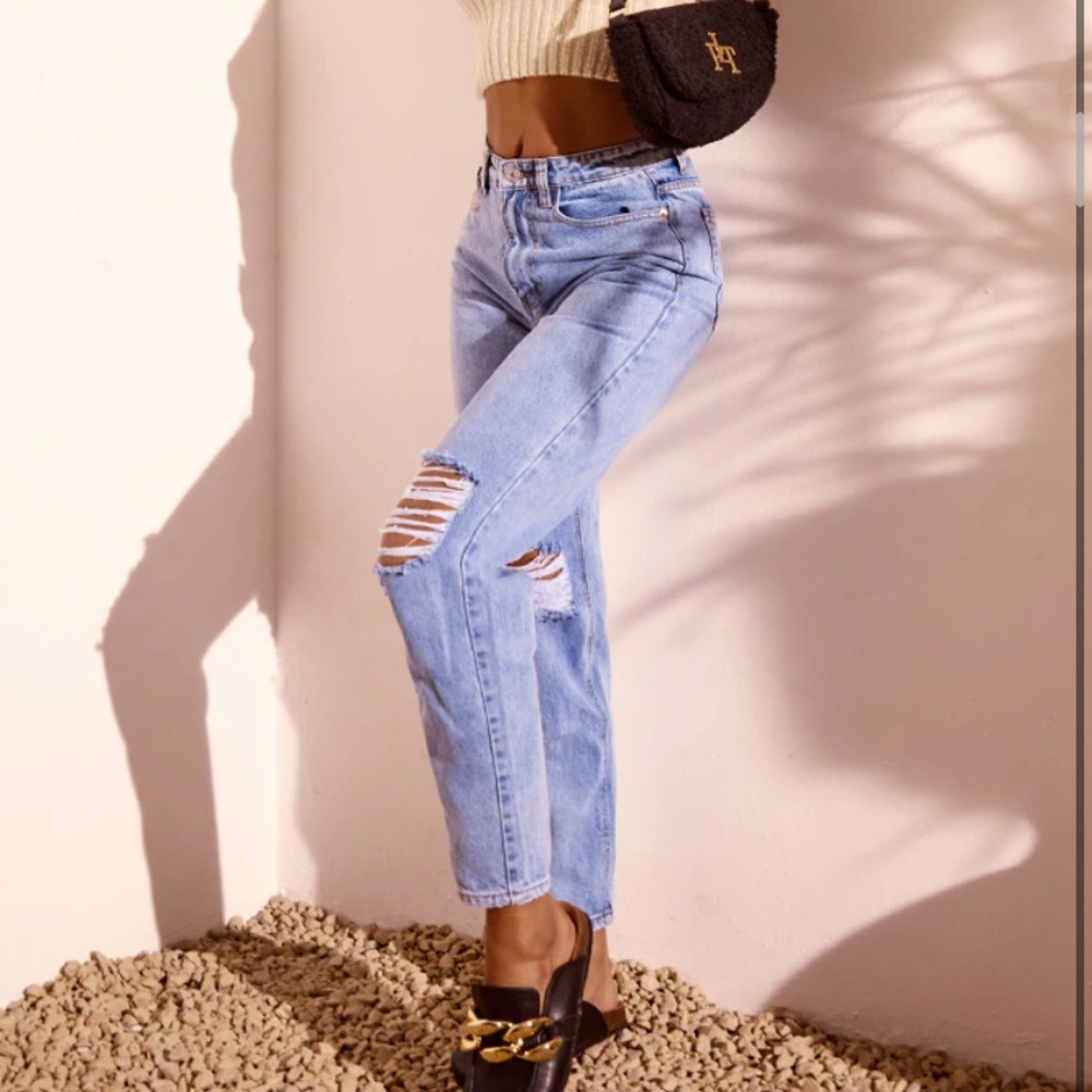 Blue ripped mom jeans.